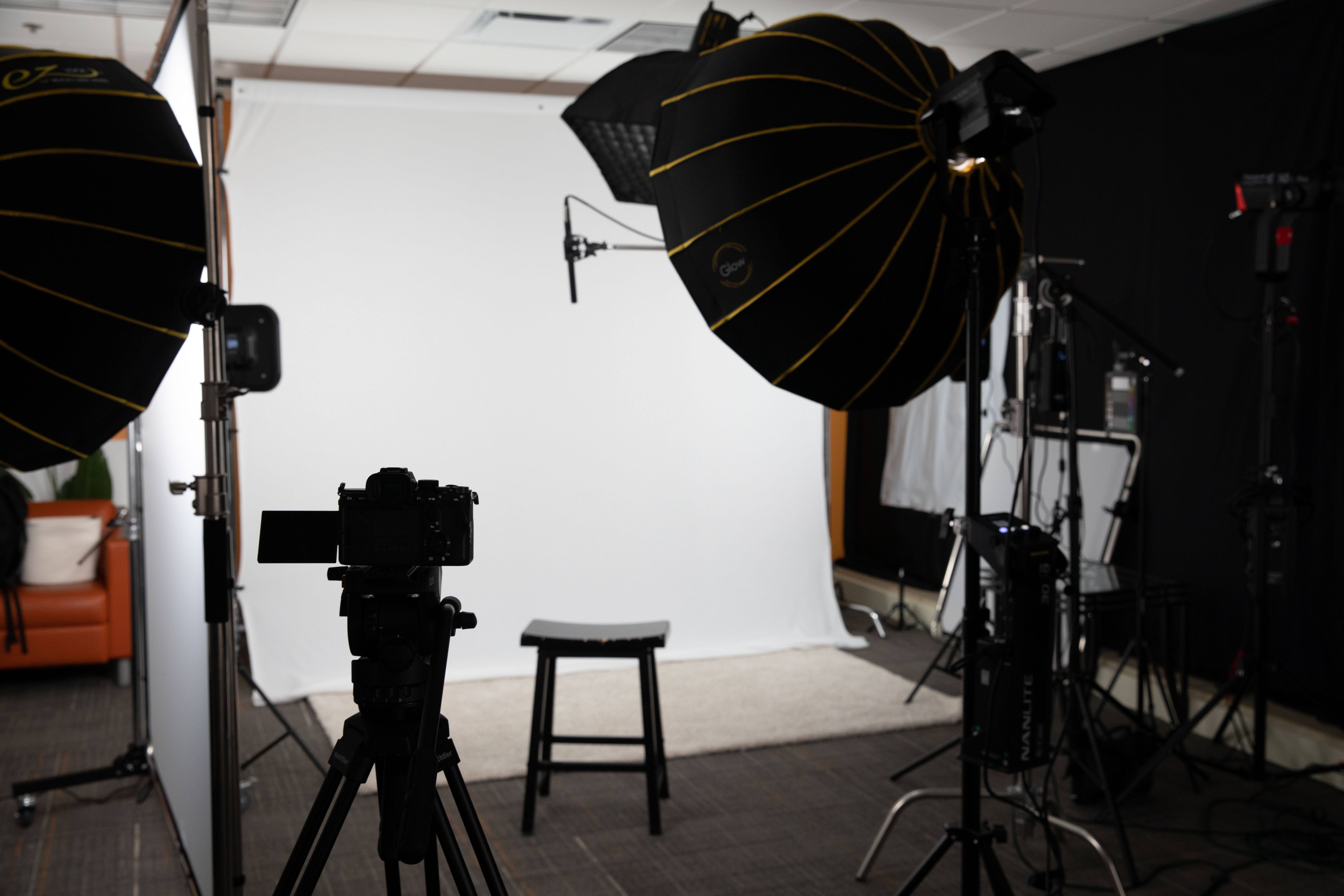 set design with camera, lights and backdrop