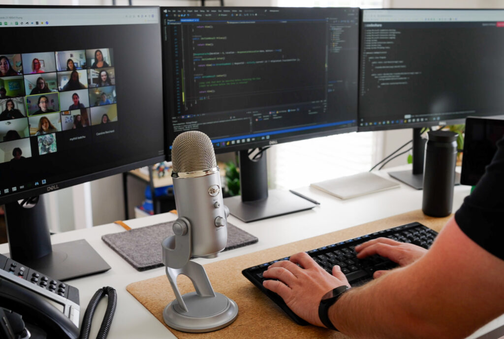 hands typing on a computer. Coding program